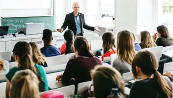 teacher instructing high school students