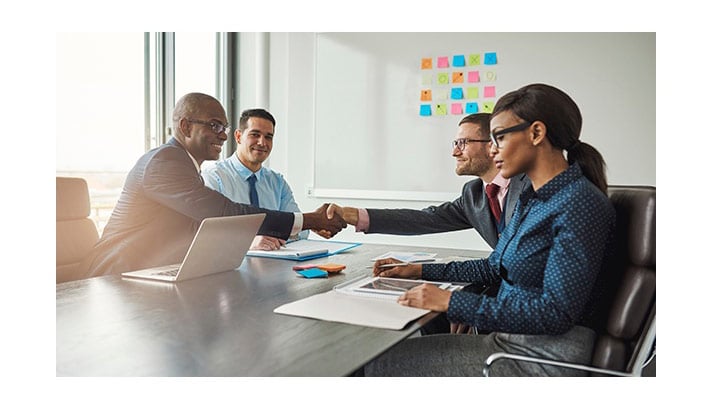 how-to-choose-a-wc-tpa-people-shaking-hands-across-table