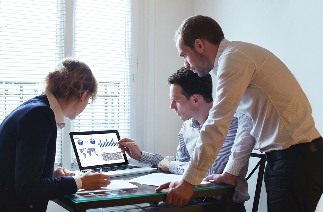 a team reviewing workers'
compensation data analytics