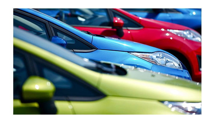 brightly-colored-cars-in-a-row